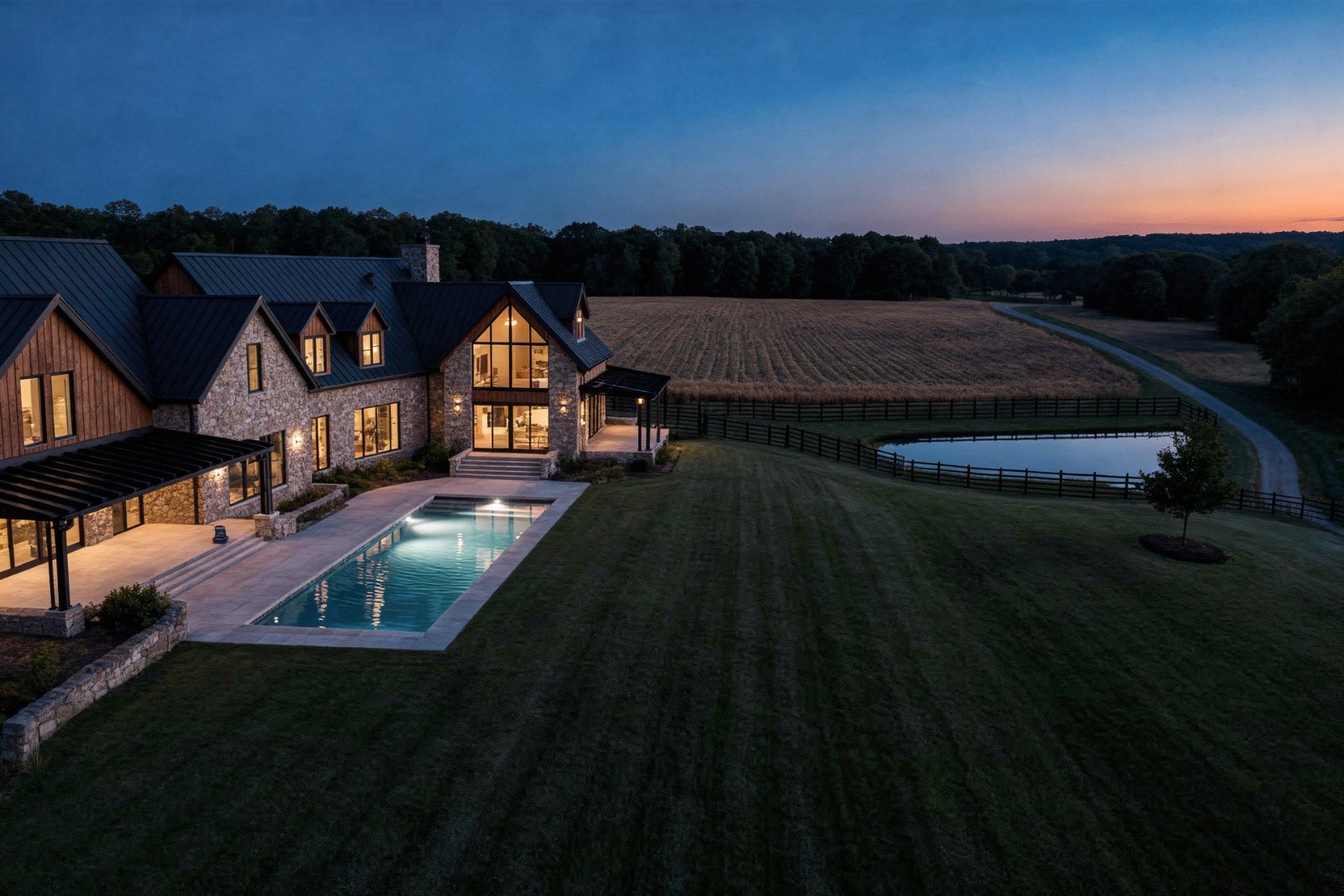 Artist's concept: drone view at dusk of the house, pool and meadow